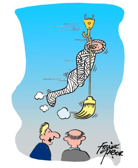 Man wrapped in bandages hanging from crane hook sweeping floor holding broom in his teeth.  Manager comments to another worker . . .